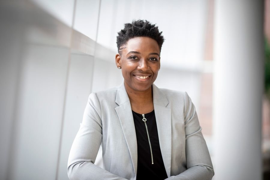 Smiling accountant in a light grey blazer